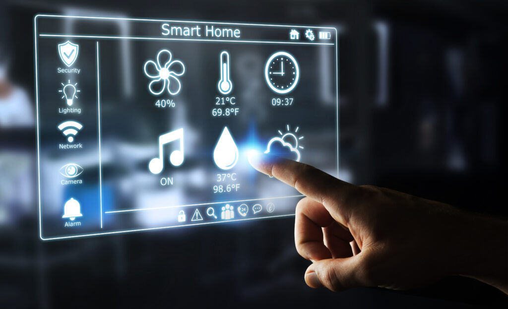 A person touching the screen of a smart home device.